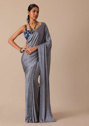 Blue Printed Saree In Satin With Tassel Detail And Unstitched Blouse Fabric