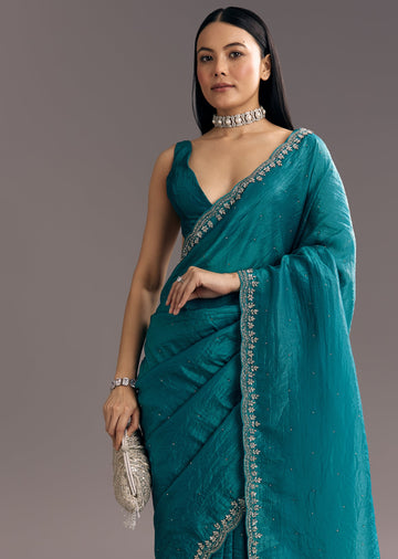 Teal Blue Crushed Tissue Stone Embellished Saree With Cutdana Scallop Border