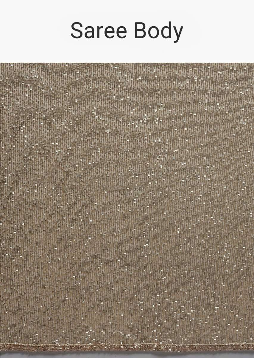 Gold Beige Saree Embellished In Sequins With Fringes On The Pallu And Unstitched Blouse