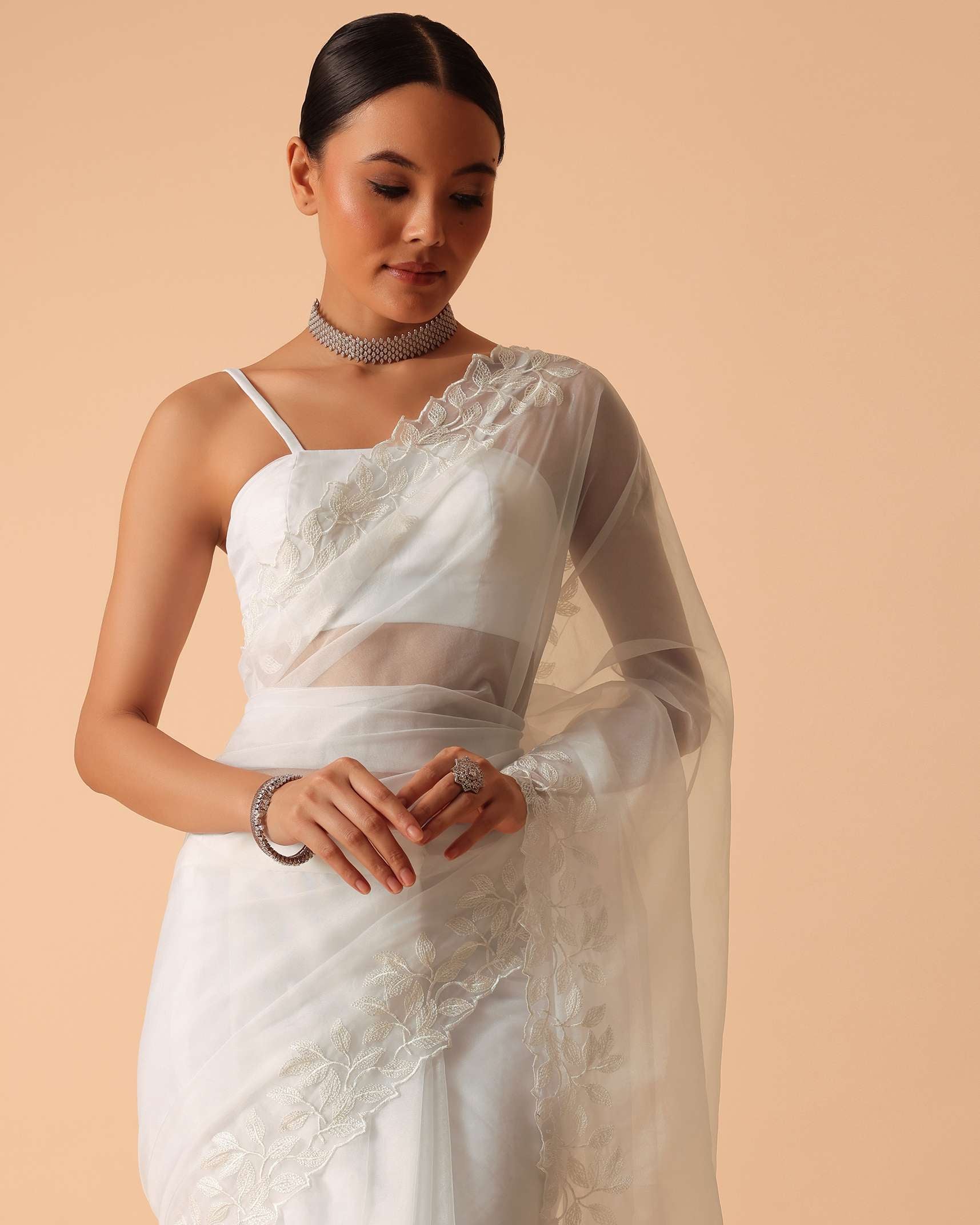 White Saree In Organza With Floral Motif Border And Unstitched Blouse Piece