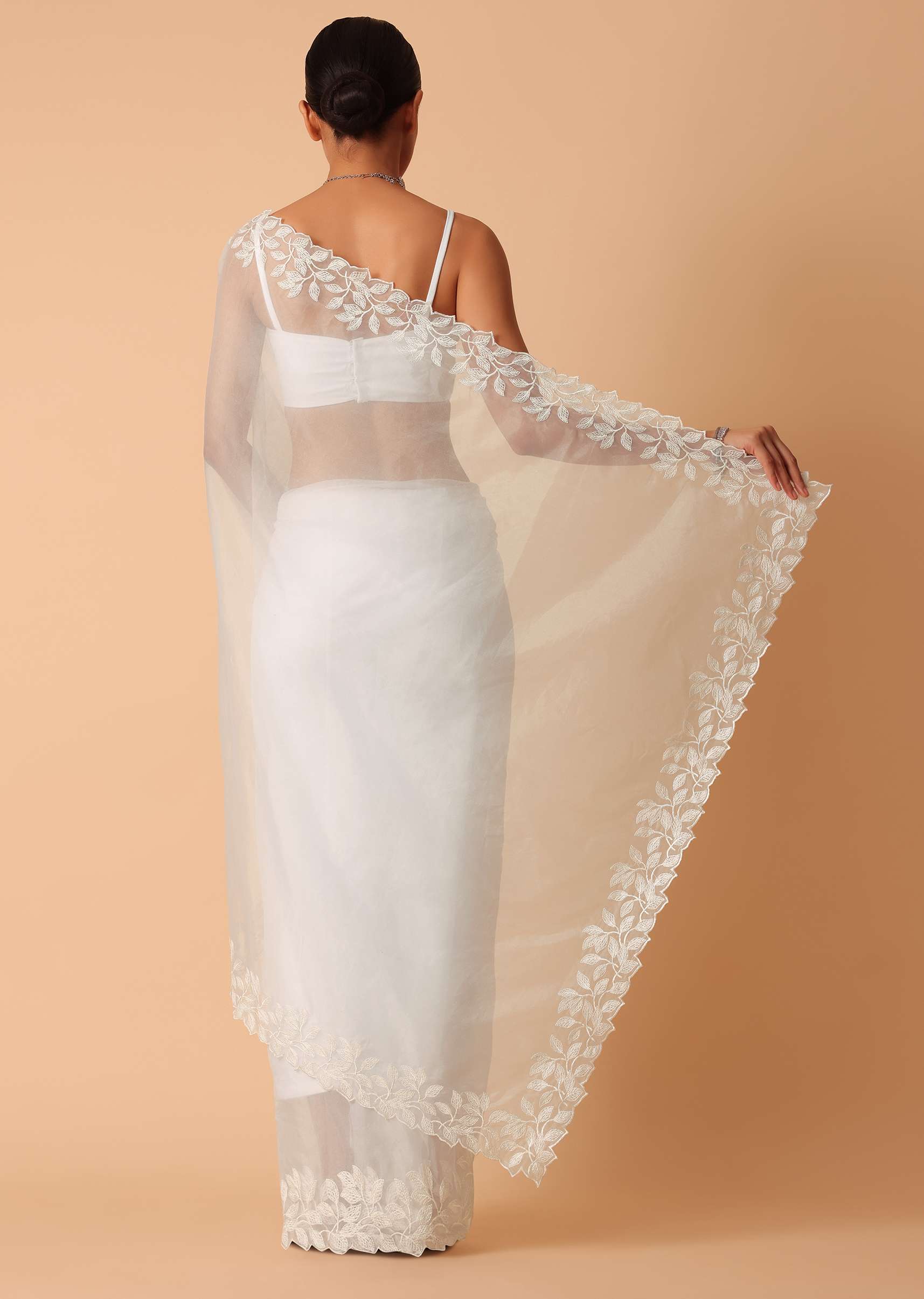 White Saree In Organza With Floral Motif Border And Unstitched Blouse Piece